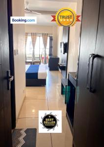 a view of a bedroom with a bed in a room at JB Residency Zirakpur !! Top Rated & Most Awarded Property in Zirakpur in Zirakpur