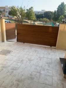 a wooden fence in front of a building at Park View Residency 1 in Rawalpindi