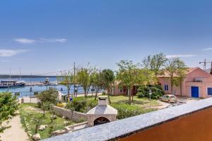 a view from the balcony of a house at House MARISSA by the sea with sea view in Nerezine