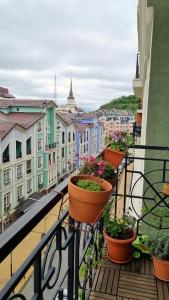 a balcony with pots of plants on a building at Kyiv Jungle apartment in Kyiv