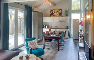 a kitchen and dining room with a table and chairs at Lovely Home In Meijel With Wifi in Meijel