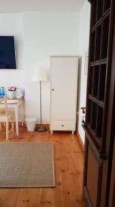 Televízia a/alebo spoločenská miestnosť v ubytovaní Willa Old House