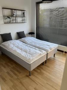 En eller flere senge i et værelse på ApartmentInCopenhagen Apartment 1587