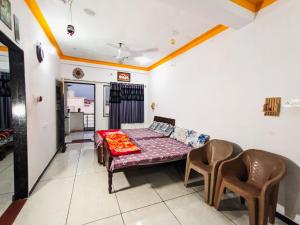 Postel nebo postele na pokoji v ubytování Bhavya Homestay