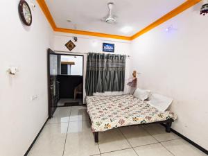 Postel nebo postele na pokoji v ubytování Bhavya Homestay
