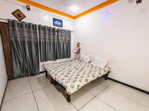 Postel nebo postele na pokoji v ubytování Bhavya Homestay