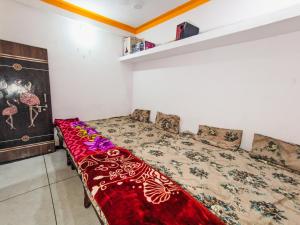 Postel nebo postele na pokoji v ubytování Bhavya Homestay