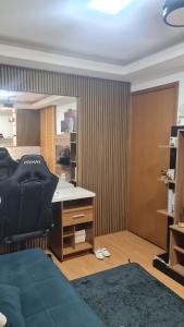 a bedroom with a desk and a bed and a mirror at Apartament litoral norte NatalRN in Natal +24 photos