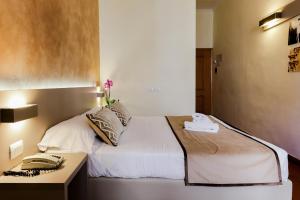 Postel nebo postele na pokoji v ubytování Albergo Firenze