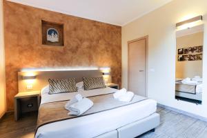 Postel nebo postele na pokoji v ubytování Albergo Firenze