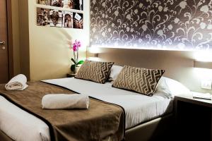 Postel nebo postele na pokoji v ubytování Albergo Firenze