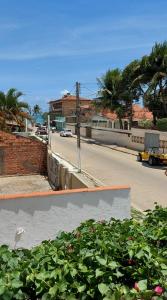 a view of a city street with a building and a street at Pousada Mandakaru in Maragogi