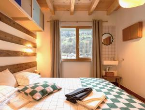 Letto o letti in una camera di SoHome Le Chable