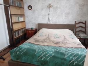 a bedroom with a bed with the words eiffel tower at Tilda&Matilda in Kutaisi