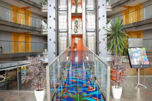 a hallway with a colorful floor in a building at Eurohotel Barcelona Granvia Fira in Hospitalet de Llobregat