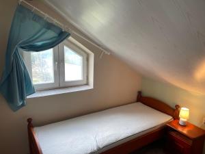 Postel nebo postele na pokoji v ubytování Pokoje Gościnne - Apartamenty MATI