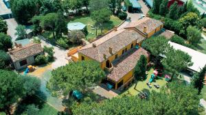 an overhead view of a large yellow house at Il Podere Del Germano Reale in Coriano