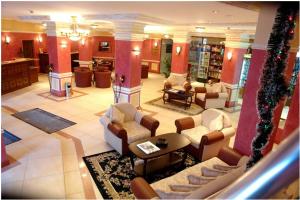 a large room with couches and chairs in a lobby at Grand Monastery 3 Apartment 10 in Pamporovo