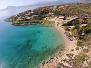 an aerial view of a beach with people in the water at Eleftherias Suites - Near Beach Apartments in Marathi