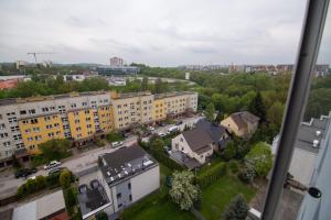 a view from a window of a city with buildings at Dwupokojowy Apartament 700 m od Szpital Prokocim in Kraków