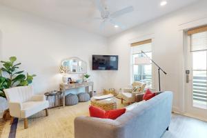 a living room with a couch and two chairs at Fairway Sunsets in Port Aransas