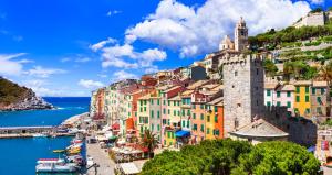 a group of buildings on a hill next to the ocean at Casa Maggiali in Portovenere