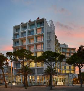 a rendering of a building with trees in front at Hotel Aromar in Platja  d'Aro