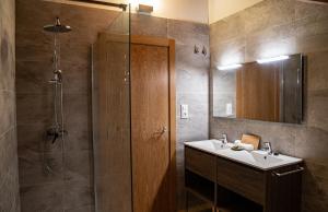 a bathroom with a sink and a shower at As Fuebas de Patricio in Vío +43 photos