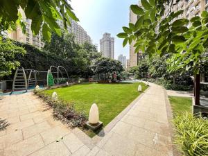 a park with a playground in a city at 1BHK In Hiranandani Powai (F) in Mumbai