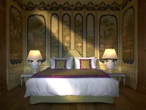 a bedroom with a large bed with two lamps at LeCrans in Crans-Montana