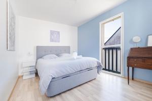 Ένα ή περισσότερα κρεβάτια σε δωμάτιο στο Maison tout à pied Le Croisic