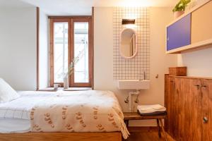 Letto o letti in una camera di SoHome Le Chable