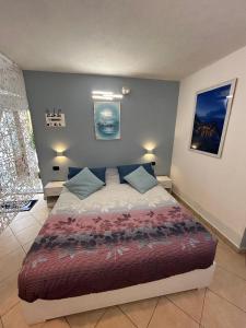 a bedroom with a large bed in a room at Vela Azzurra in Manarola