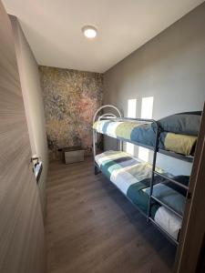 Postel nebo postele na pokoji v ubytování Corte Grande Apartment