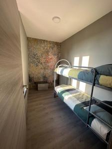 Postel nebo postele na pokoji v ubytování Corte Grande Apartment