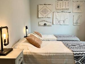 a bedroom with a bed and a table with a lamp at Sweet Stay with fully fenced yard in Sanford
