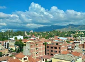 a view of a city with buildings and mountains at Andaluz Downtown Suite in Tarija