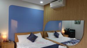 Tempat tidur dalam kamar di Hotel 9 Việt Đức Sea