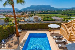 a swimming pool with a view of a villa at Villa Socrates by Abahana Villas in Calpe