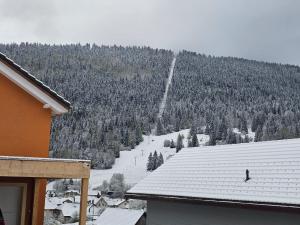 a view of a snow covered mountain from a house at Elo Global Appart in Buttes