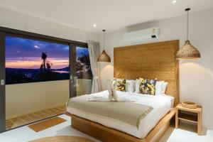 a bedroom with a large bed and a large window at VIlla Tramonto sunset seaview villa Koh Samui in Koh Samui +55 photos