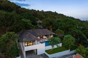 an aerial view of a house with a swimming pool at VIlla Tramonto sunset seaview villa Koh Samui in Koh Samui