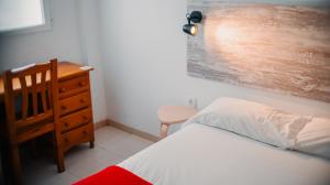 Postel nebo postele na pokoji v ubytování Barraca Suites