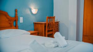 Postel nebo postele na pokoji v ubytování Barraca Suites