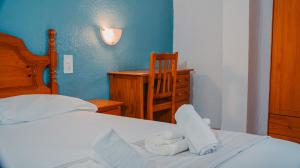 Postel nebo postele na pokoji v ubytování Barraca Suites