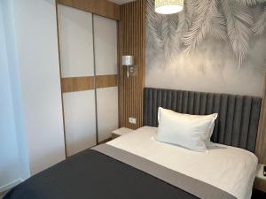 Ένα ή περισσότερα κρεβάτια σε δωμάτιο στο Coquette Studio Central