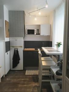 Η κουζίνα ή μικρή κουζίνα στο Studio Ria d'Etel