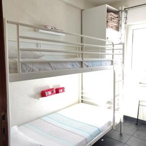 a bunk bed room with two bunk beds at Turpino House in Vilar Torpim