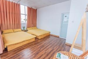 Postel nebo postele na pokoji v ubytování CSLTDL Địa Du