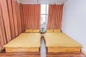 Postel nebo postele na pokoji v ubytování CSLTDL Địa Du